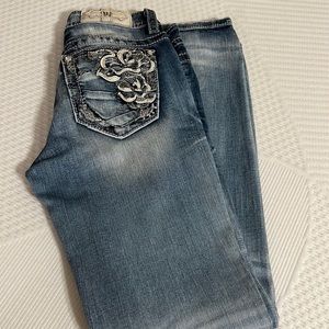 A pair of light distress denim skinny jean